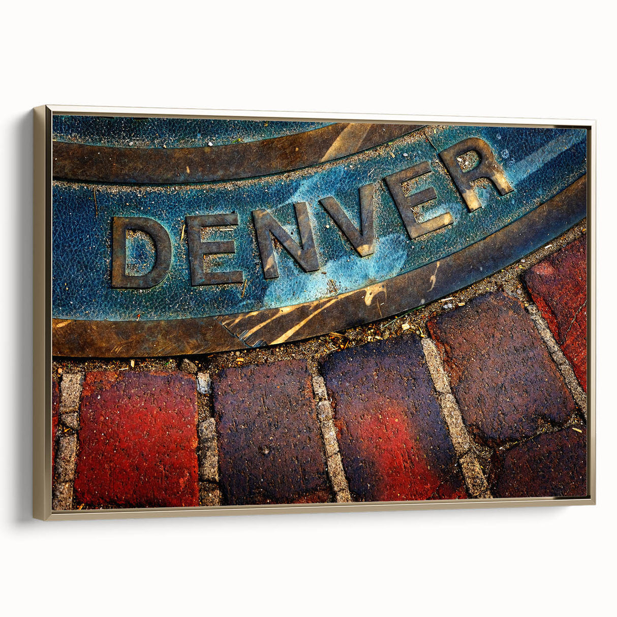 Framed canvas featuring a vintage-style landscape painting of Denver, Colorado, in muted gold and black tones.