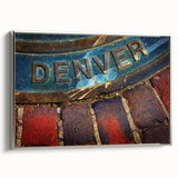 Framed canvas depicting a vintage-style landscape painting of Denver, Colorado, in vibrant colors on a black background.