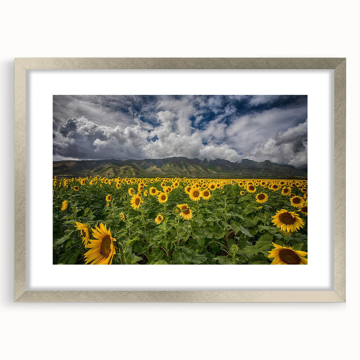 Textured abstract art print of Maui scenery in muted green and blue tones, framed in silver, ideal for bedroom art.