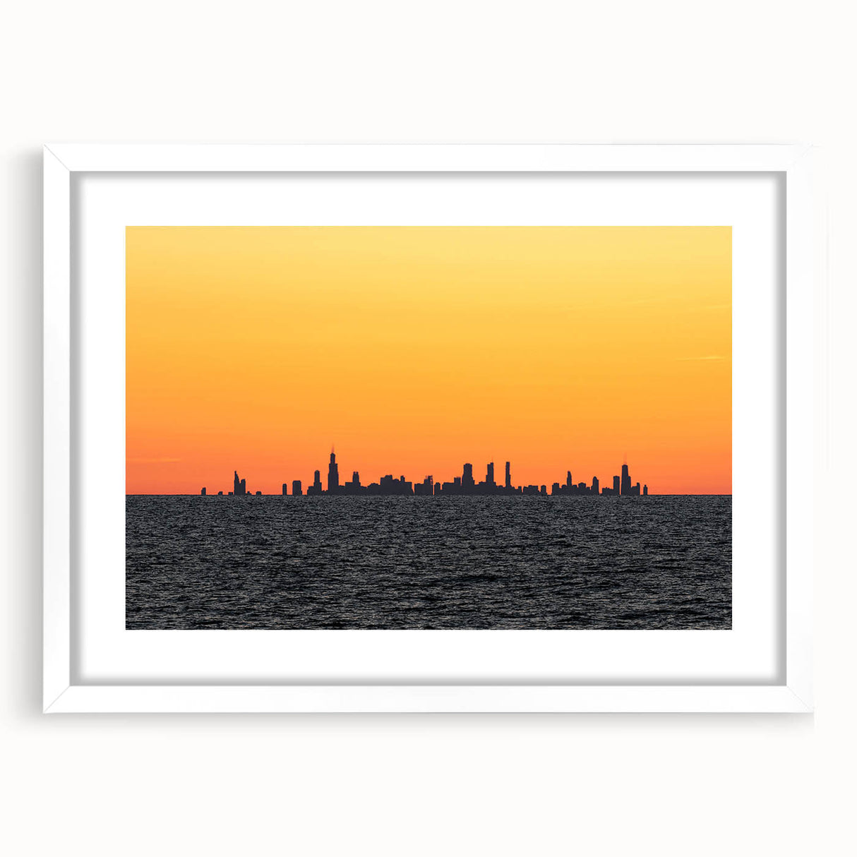 Abstract art print of Chicago skyline in muted gray and blue tones on a framed white mat, suitable for dining room decor.