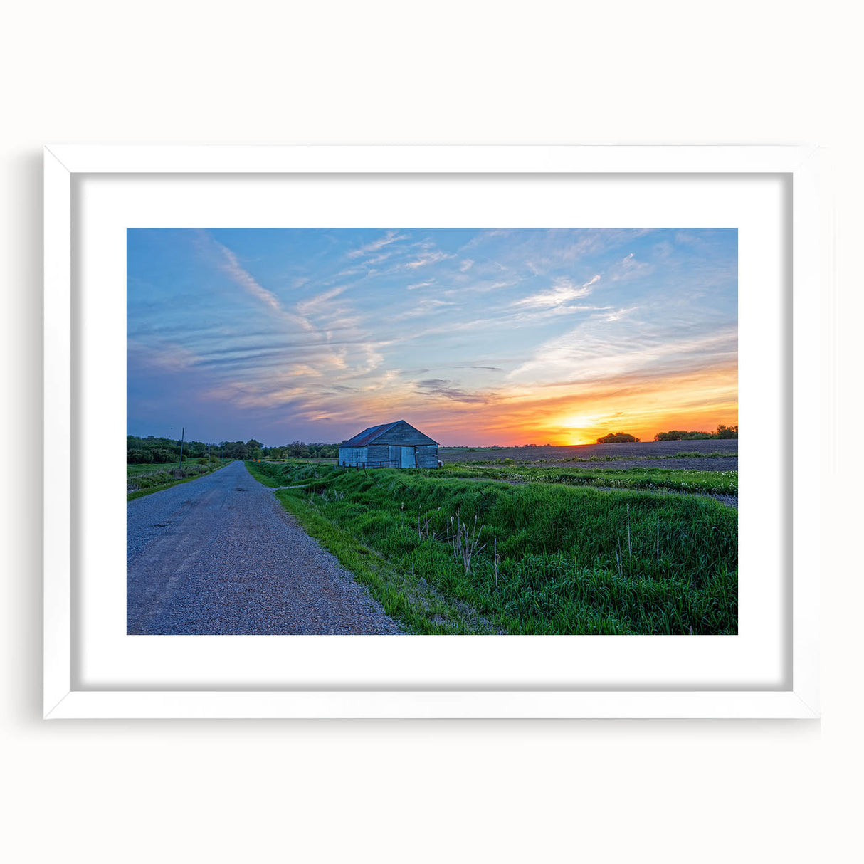 Abstract art print of Iowa scenery in muted earth tones on a white matted frame, ideal for dining room decor.