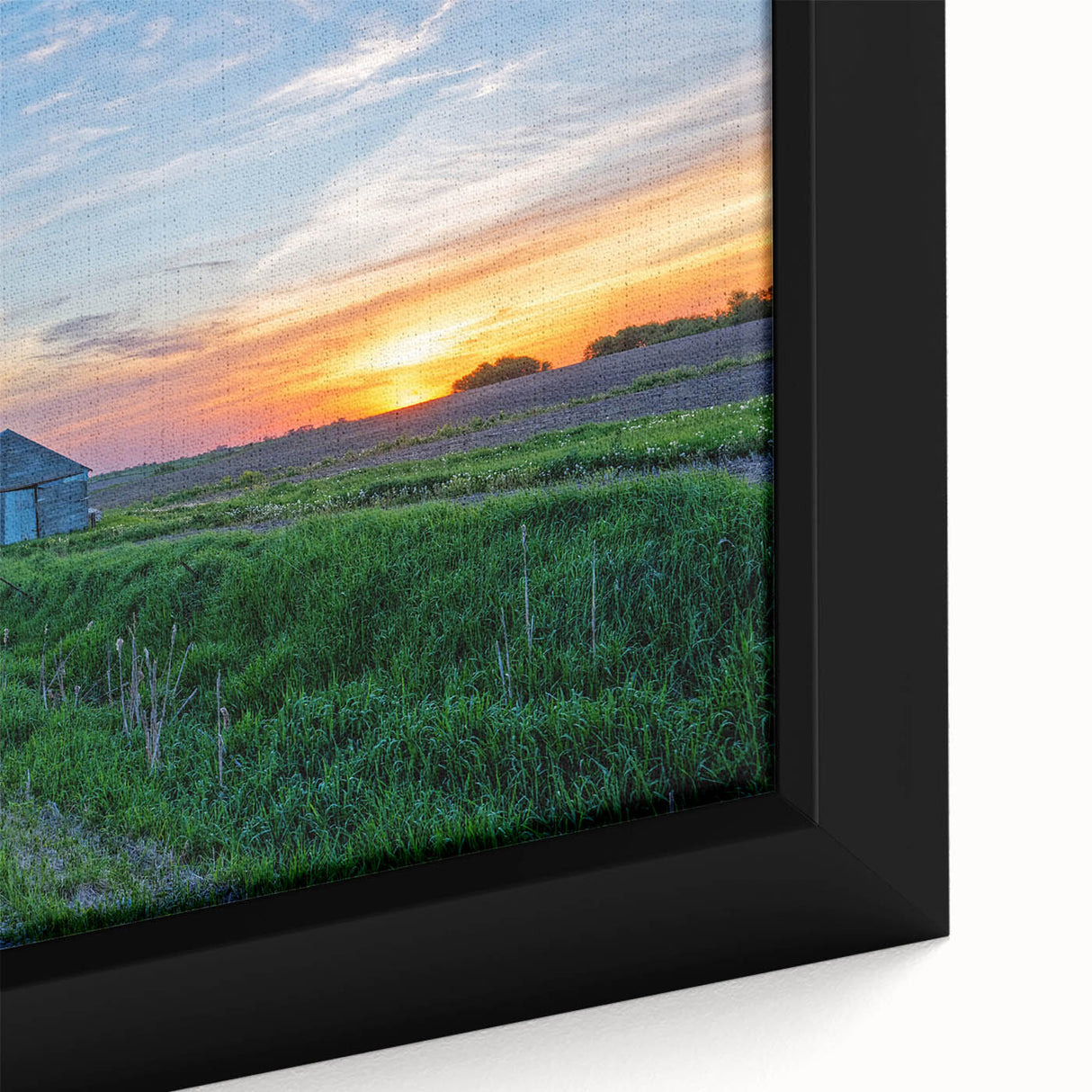 Close-up of a textured, extra large black wall art depicting Iowa scenery on a framed canvas, featuring colorful art accents.
