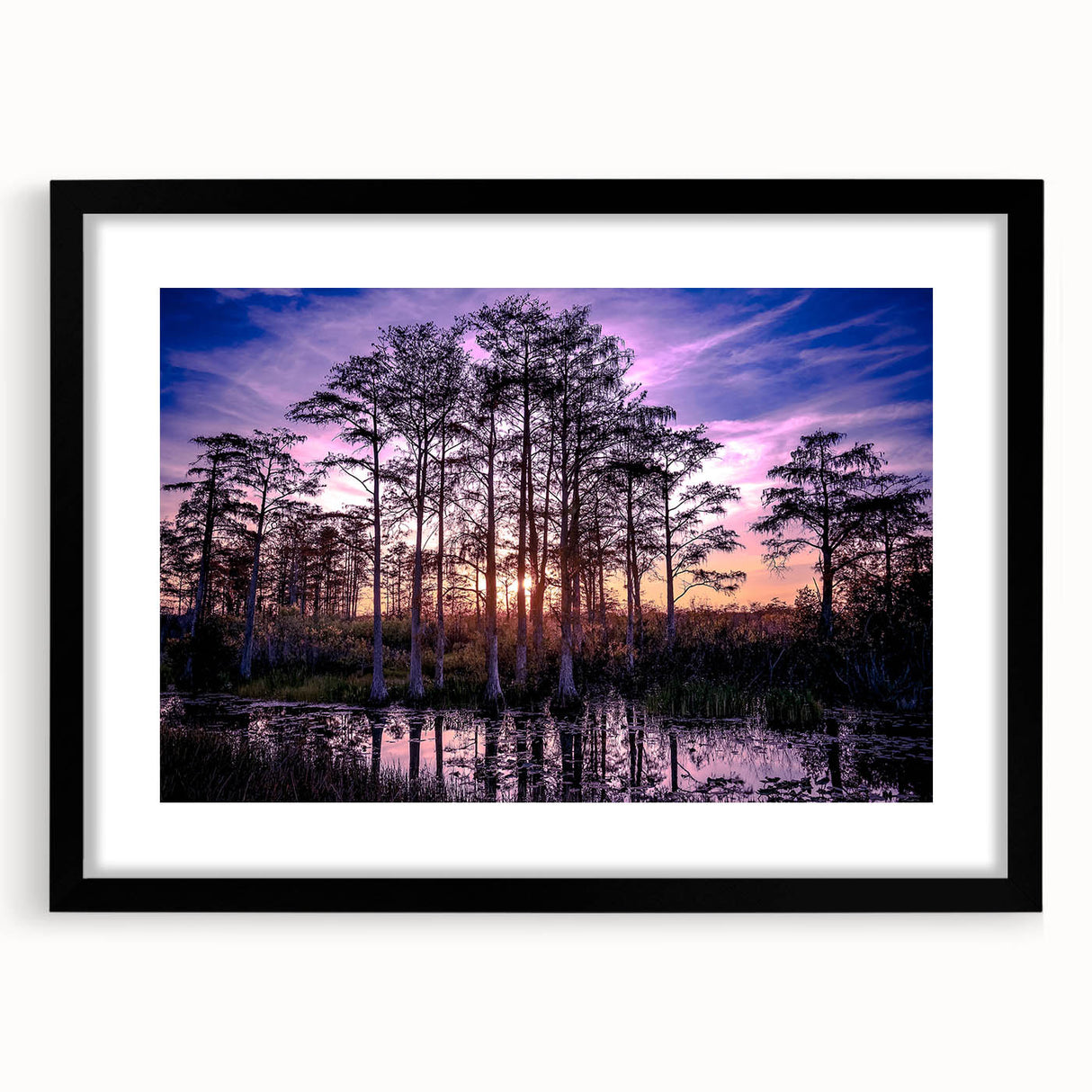 Abstract art print of a Louisiana landscape in vibrant colors on a large framed canvas, ideal for living room decor.