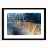 Colorful abstract art print of Michigan's Upper Peninsula in vibrant hues on a textured canvas, framed in black.
