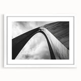 Abstract art print of St. Louis skyline in muted gray and blue tones on a framed white mat, suitable for dining room decor.