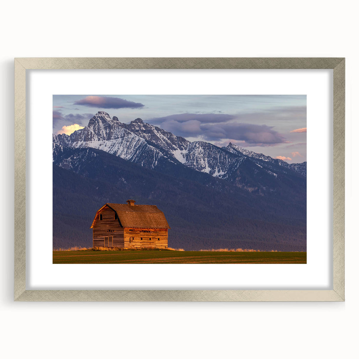 Textured abstract art print of Montana scenery in muted earth tones, framed in silver, ideal for bedroom art.
