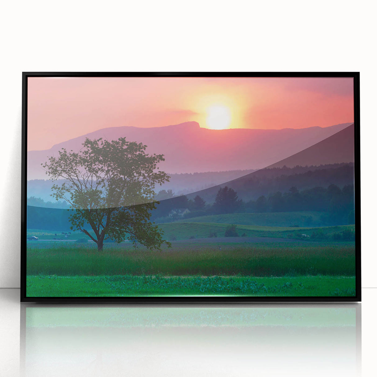Large abstract wall art depicting a Vermont landscape in muted green and brown tones, framed in black acrylic.