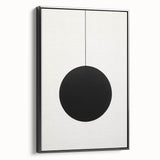 Framed minimalist wall art featuring an abstract design in black, displayed from a side view against a neutral background, ideal for modern decor.