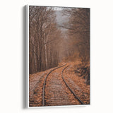 Vintage poster art of an autumnal scene on a framed canvas, featuring a palette of orange and brown.