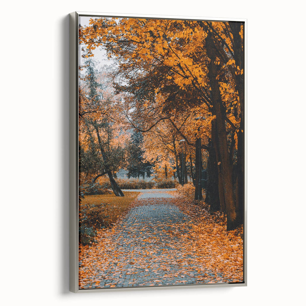 Framed canvas featuring a vintage-style landscape painting of autumn trees with colorful foliage against a black background.