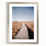 Textured abstract art print depicting autumn colors in orange and brown on a silver-framed canvas.