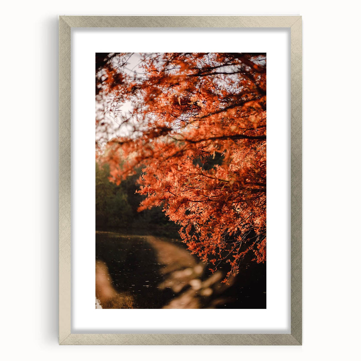 Textured abstract art print in orange and brown tones on a framed canvas, suitable for bedroom decor.