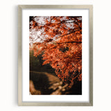 Textured abstract art print in orange and brown tones on a framed canvas, suitable for bedroom decor.