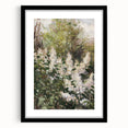 Abstract floral artwork framed in a sleek black mat, showcasing vibrant colors and intricate patterns, perfect for modern home decor or artistic displays.