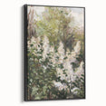 Framed canvas artwork showcasing abstract floral designs in vibrant colors, presented with a sleek black frame for a modern aesthetic, ideal for home decor.