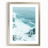 Textured abstract art print in silver frame, featuring soft gray and white swirls on canvas, suitable for bedroom decor.
