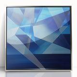 Abstract geometric framed acrylic artwork in silver tones, showcasing modern design elements and sharp lines, perfect for contemporary home decor.