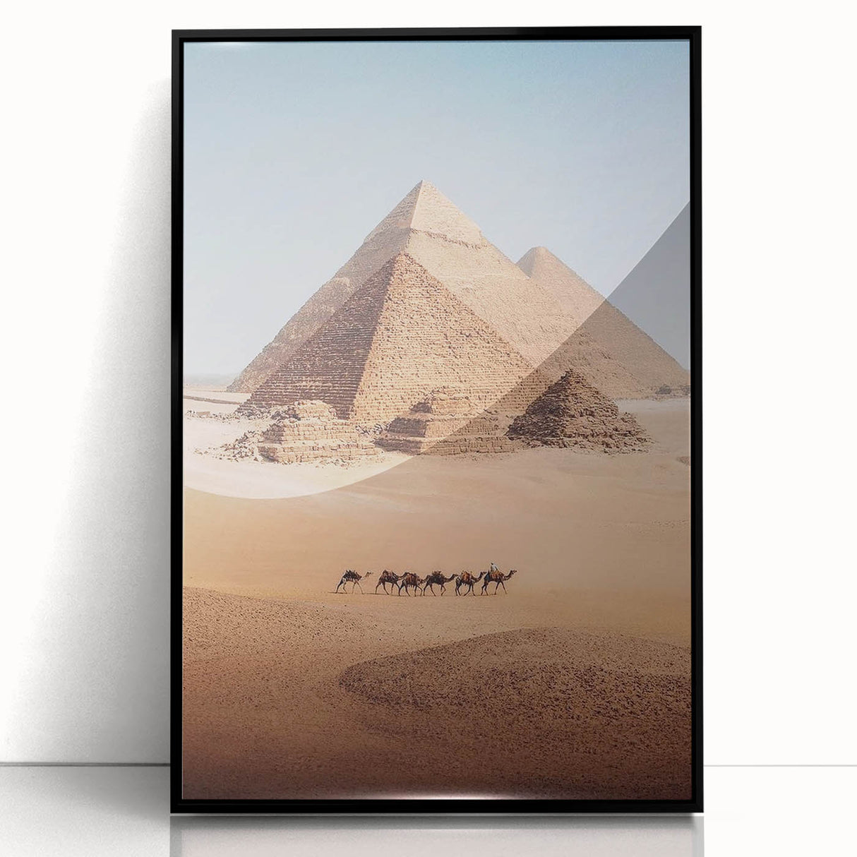 Large abstract wall art depicting a minimalist Egyptian scenery in muted earth tones, framed in black acrylic.