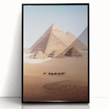Large abstract wall art depicting a minimalist Egyptian scenery in muted earth tones, framed in black acrylic.