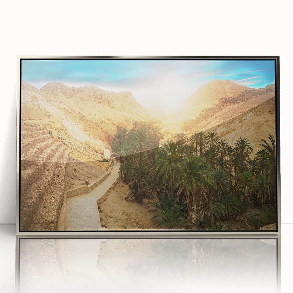 Mid-century modernist art depicting a Tunisian landscape in muted earth tones on a silver-framed acrylic print.