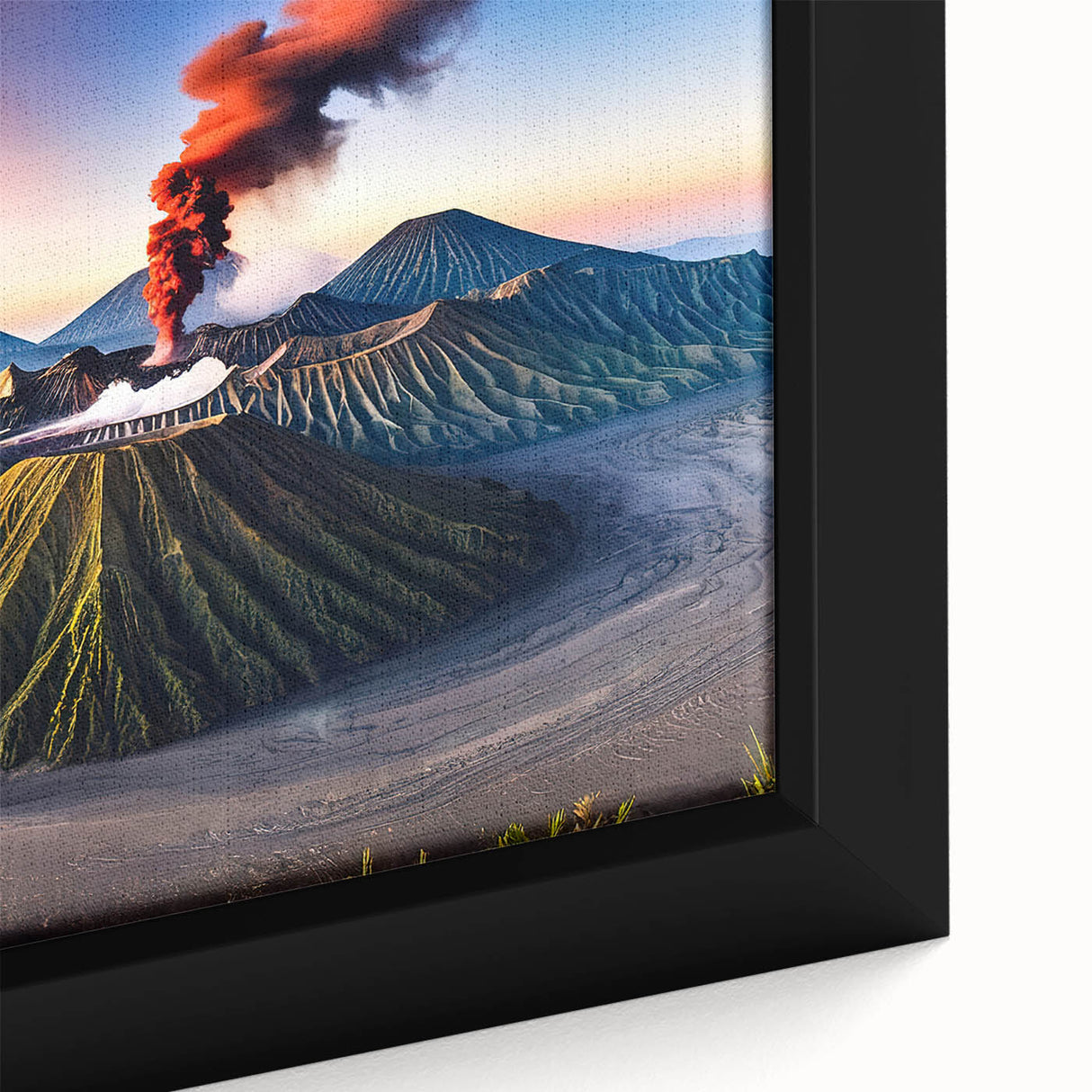 Close-up of black wall art featuring a textured Indonesian landscape on a framed canvas, with vibrant colors.