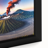 Close-up of black wall art featuring a textured Indonesian landscape on a framed canvas, with vibrant colors.