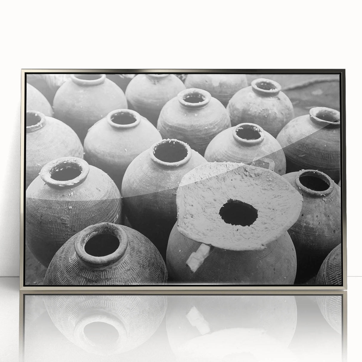 Mid-century modernist art depicting a Laos scenery in muted earth tones on a silver-framed acrylic print.