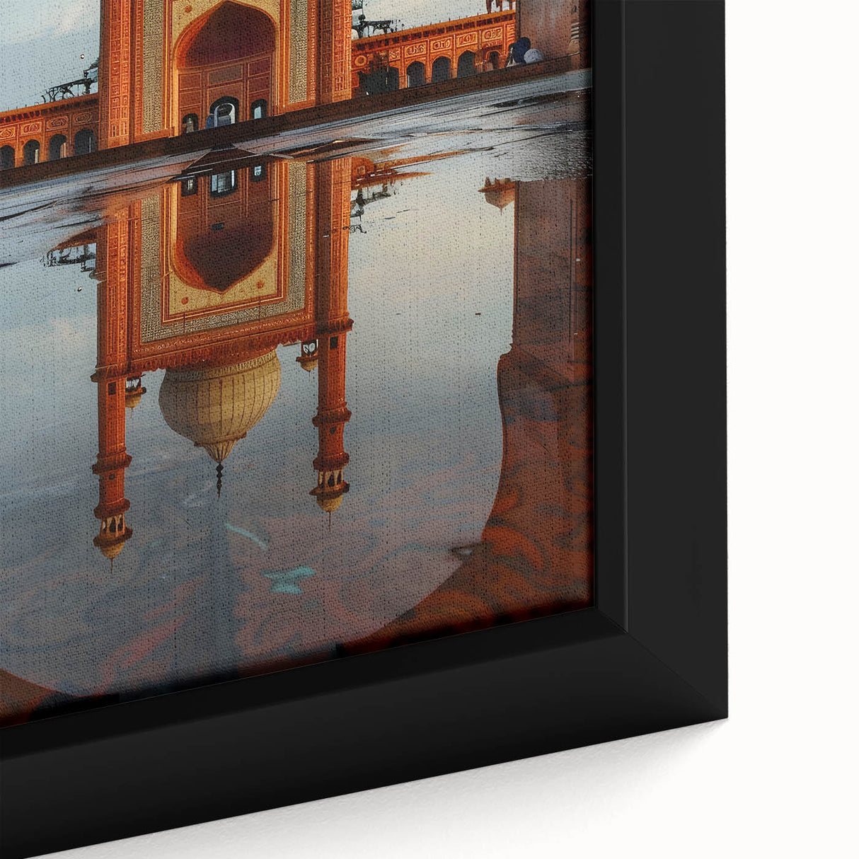 Close-up of black wall art featuring a textured, colorful Pakistani scenery on a framed canvas.