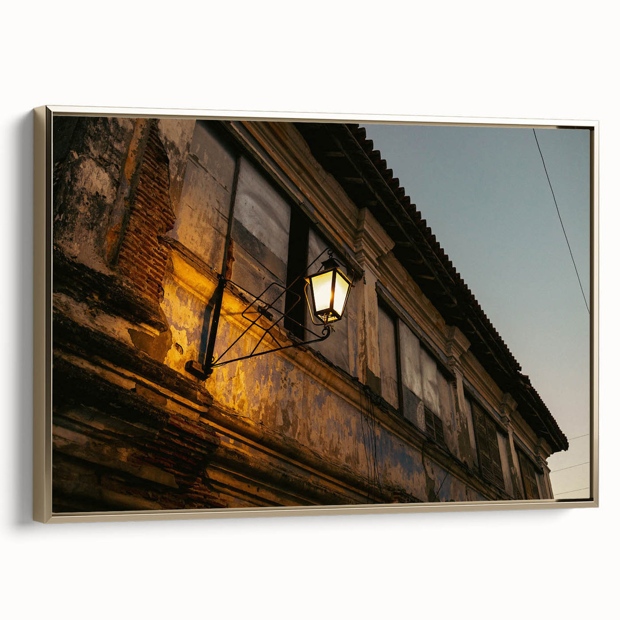 Framed canvas landscape painting of a serene Philippine scenery in muted gold and black tones, ideal for bedroom wall art.