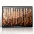 Large abstract wall art depicting a Caribbean scenery in muted blues and greens, framed in black acrylic.