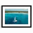 Abstract art print with vibrant Caribbean scenery in textured colors on a large framed canvas, ideal for living room decor.