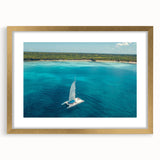 Abstract art print of Caribbean scenery in gold frame, ideal for dining room decor.