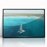 Large abstract wall art depicting Caribbean scenery in vibrant blue and green tones, framed in black acrylic.