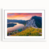 Textured art print of an abstract European scenery in muted earth tones, framed in white, ideal for bedroom ambiance.