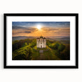 Abstract art print of a colorful European cityscape, in a black frame with mat, ideal for living room decor.