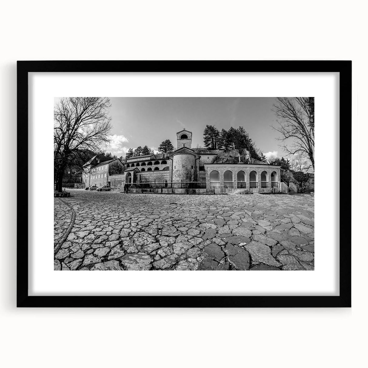 Extra large abstract art print of a colorful European scenery, textured finish on a framed black mat.