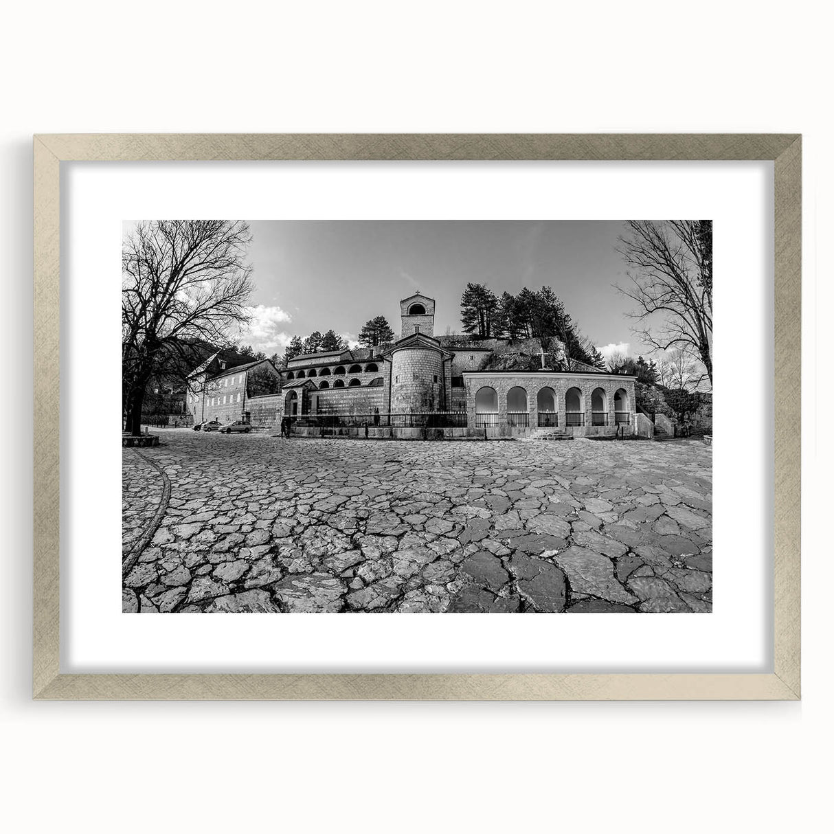 Extra large abstract art print of a Montenegro scenery in muted earth tones, framed in silver, ideal for living room decor.