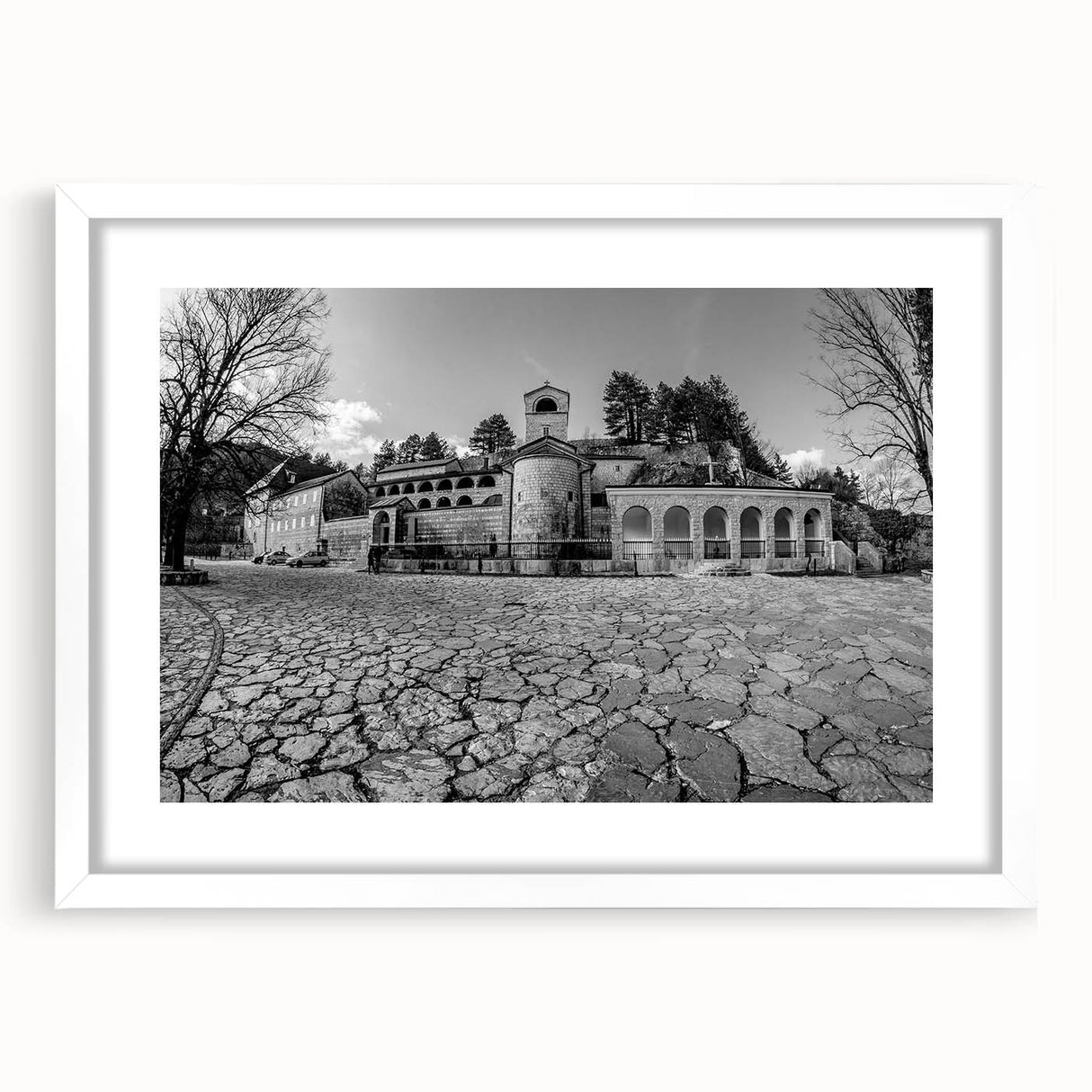 Textured abstract art print depicting a Montenegro scenery in muted earth tones, framed with a white mat.