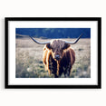 Abstract art print of a colorful, textured European scenery in a black frame, ideal for living room decor.