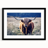 Abstract art print of a colorful, textured European scenery in a black frame, ideal for living room decor.