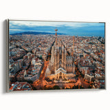 Landscape art painting of Barcelona featuring colorful buildings and a black sky, presented on a silver-framed canvas.