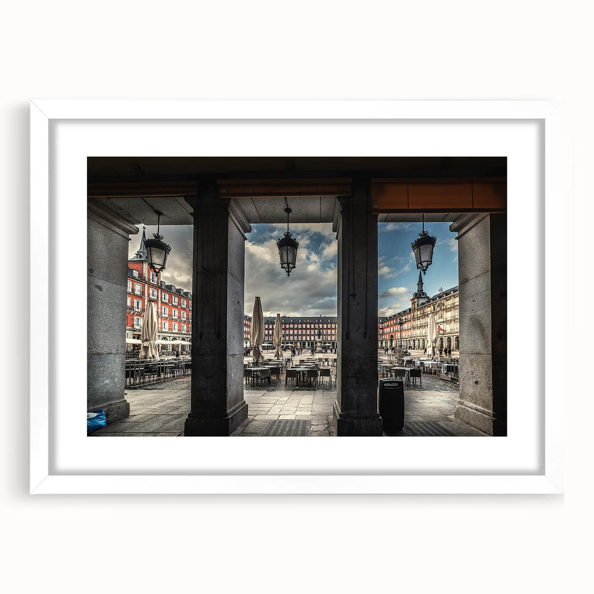 Abstract art print of Madrid skyline in muted gray and blue tones on a framed white mat, ideal for dining room decor.