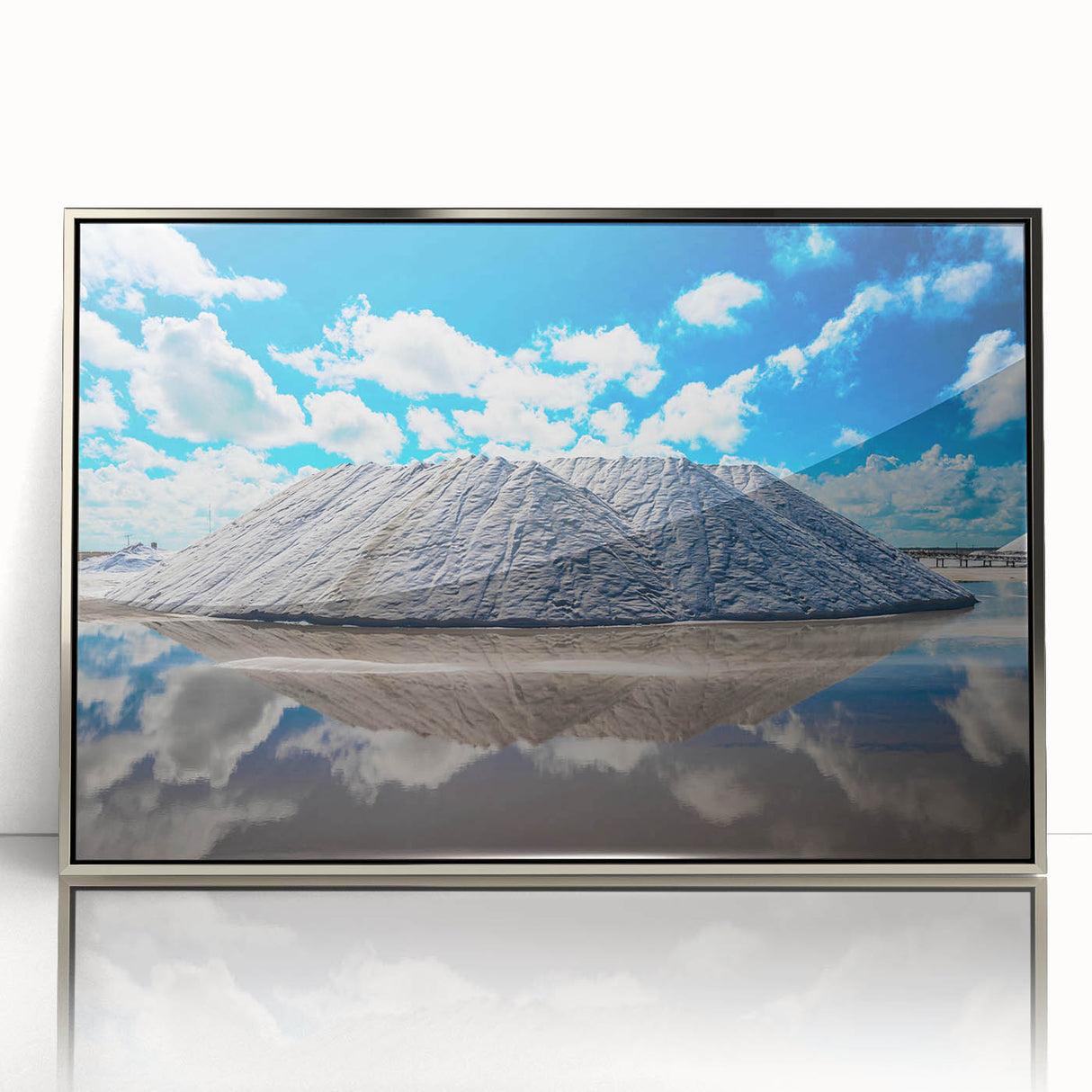 Mid-century modernist art depicting Yucatan scenery in a silver-framed acrylic, featuring earth tones.