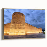 Framed canvas featuring a vintage-style landscape painting of a Middle Eastern scene in gold and black tones.