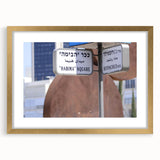 Extra large abstract art print of Tel Aviv skyline in textured gold frame, ideal for living room decor.