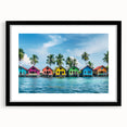 Black and white wall art featuring a vintage poster art style landscape of Tahiti, framed with a black mat.