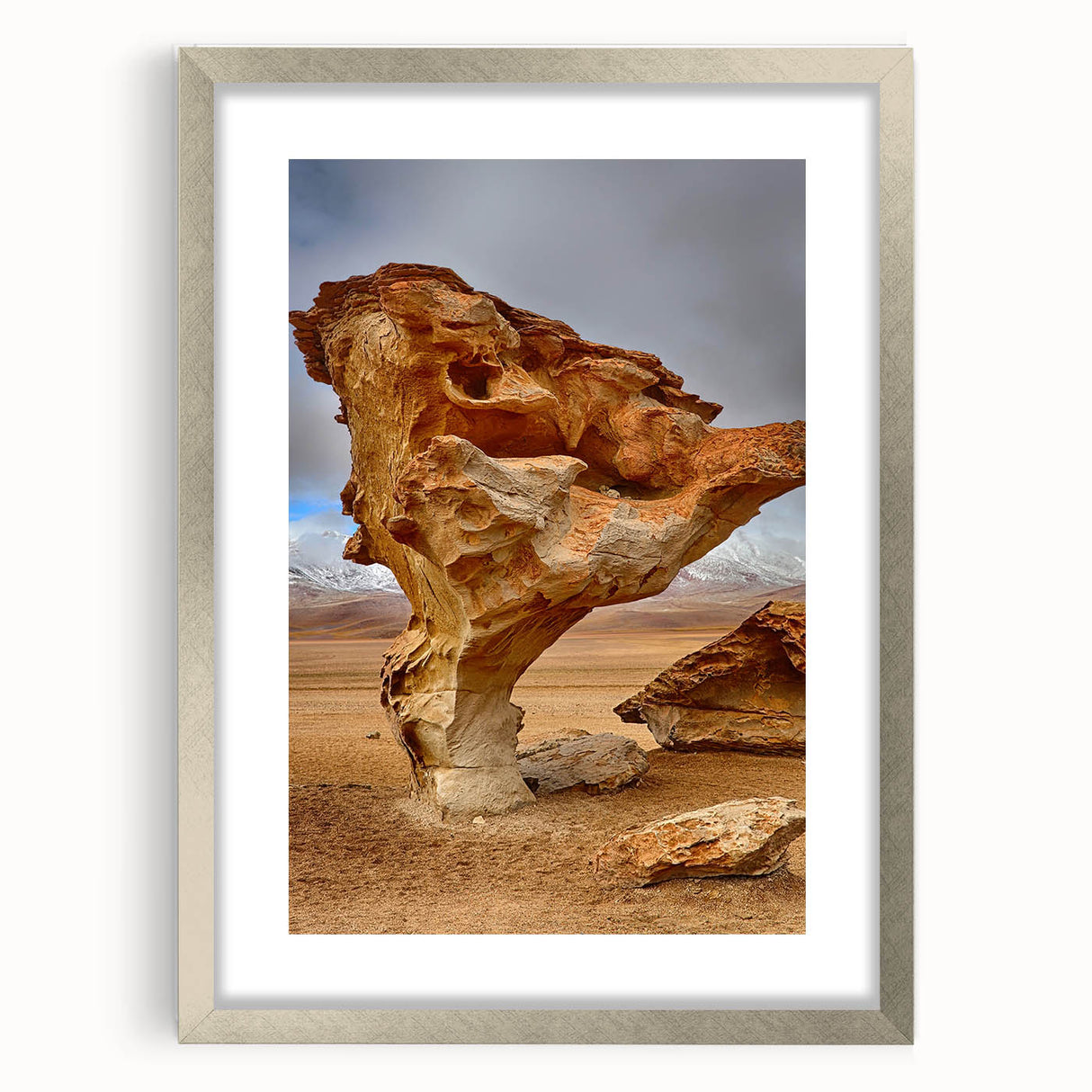 Textured abstract art print depicting a Bolivian landscape in muted earth tones on a framed silver mat.