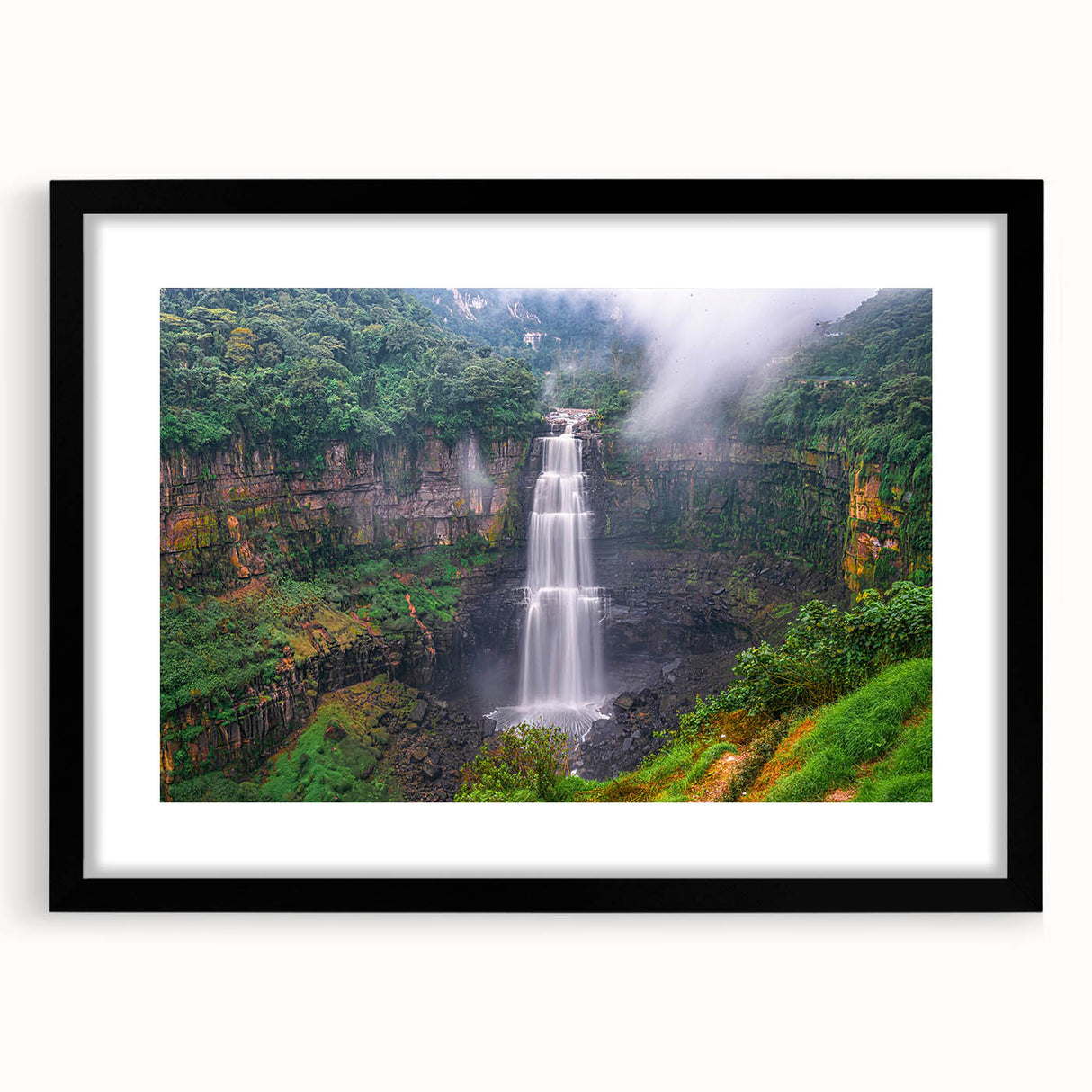 Extra large abstract art print of a colorful Colombian landscape, textured on a black framed canvas.
