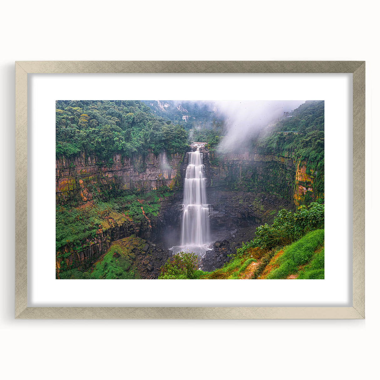 Textured abstract art print of a Colombian landscape, in silver frame, with earthy and green tones, ideal for bedroom art.