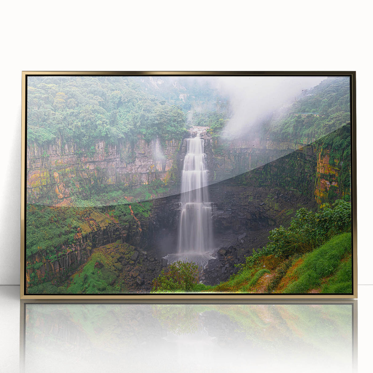 Large acrylic print of a mid-century modernist Colombian landscape in muted earth tones, framed in gold.